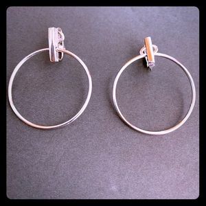 Retro Trifari Silvertone hoop earrings. Clip on